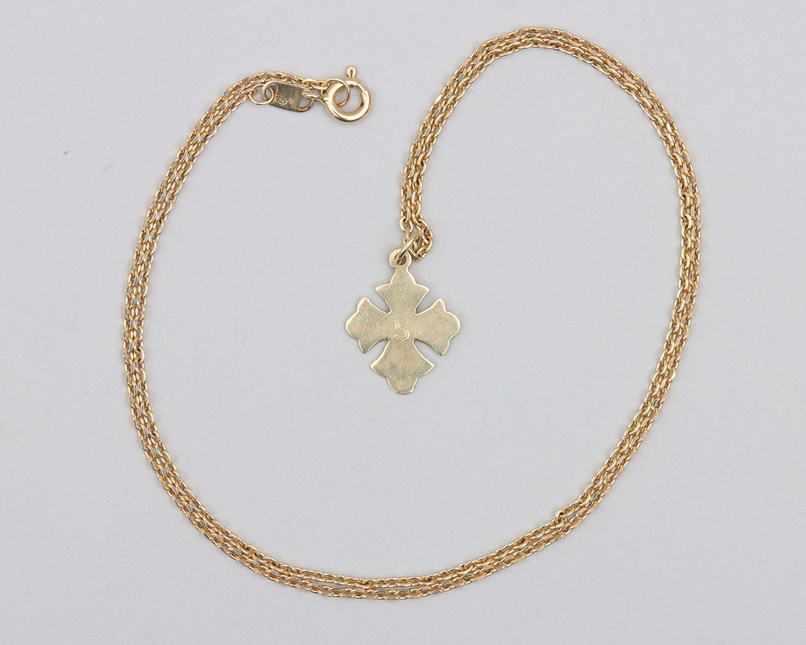 18k Gold Cross Pendant Necklace: 18k Gold Cross Pendant Necklace with patonce cross pendant, initialed "S", on cable chain, marked on pendant and clasp. Length (open) 19 1/2 in. (49.5 cm.); approximate weight 4.5 dwt (7.0 grams)