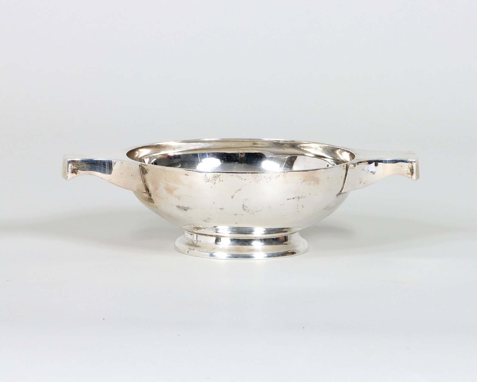 Large Scottish Sterling Silver Quaich: Large Scottish Sterling Silver Quaich Arthur Robert Angell, Edinburgh, 1969 with twin handles, hallmarked on bottom. 2 3/8 x 9 x 6 in. (6 x 22.9 x 15.2 cm.); approximate weight 13.9 troy oz. (432.6 gr