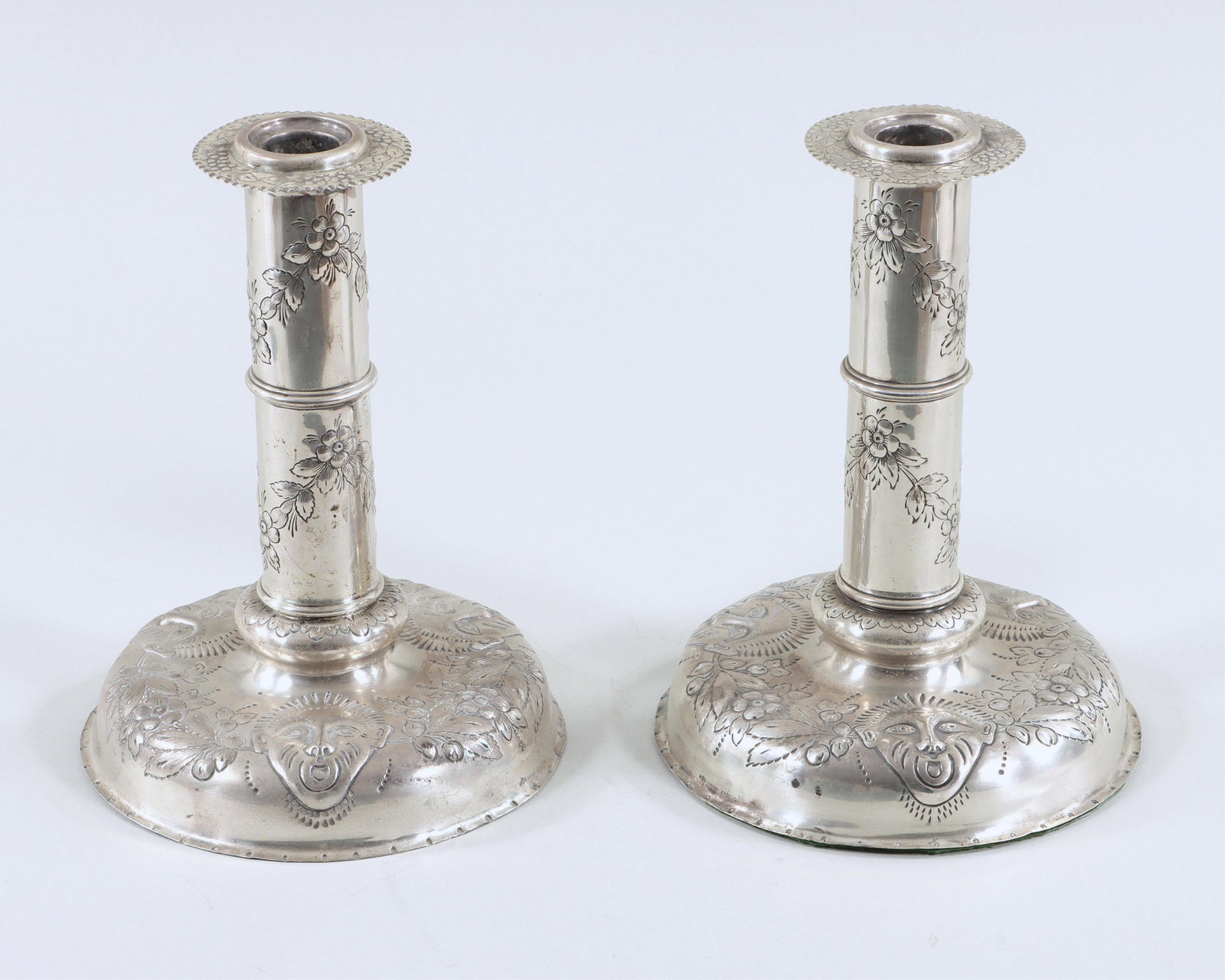 Pair of Large Gorham Sterling Candlesticks: Pair of Large Gorham Sterling Silver Repousse Candlesticks weighted, having bobeches with floral design and ruffled rim, columns with floral swags, and large domed bases with masks and floral swags, m