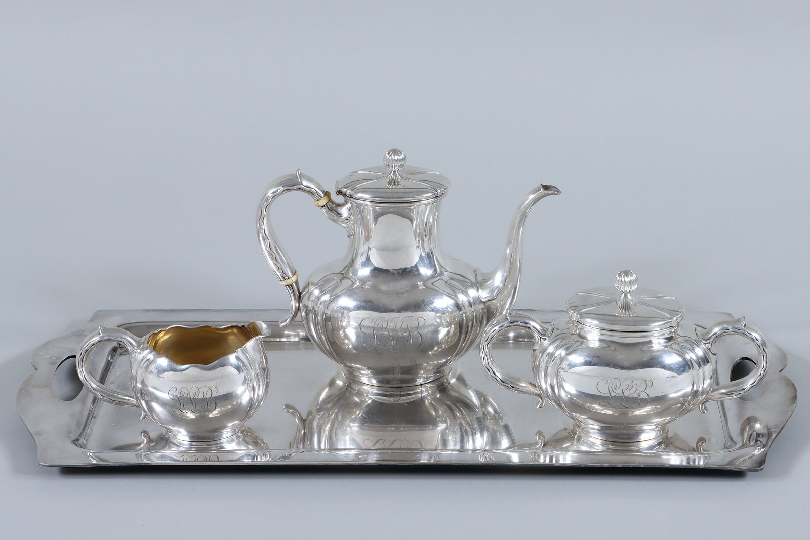 American Three-Piece Sterling Silver Tea Set: American Three-Piece Sterling Silver Tea Set Whiting Manufacturing Co., New York, NY, c. 1866-1926 in pattern having reeded ball finials, bodies with reeding at corners, and leaf-topped scroll handles