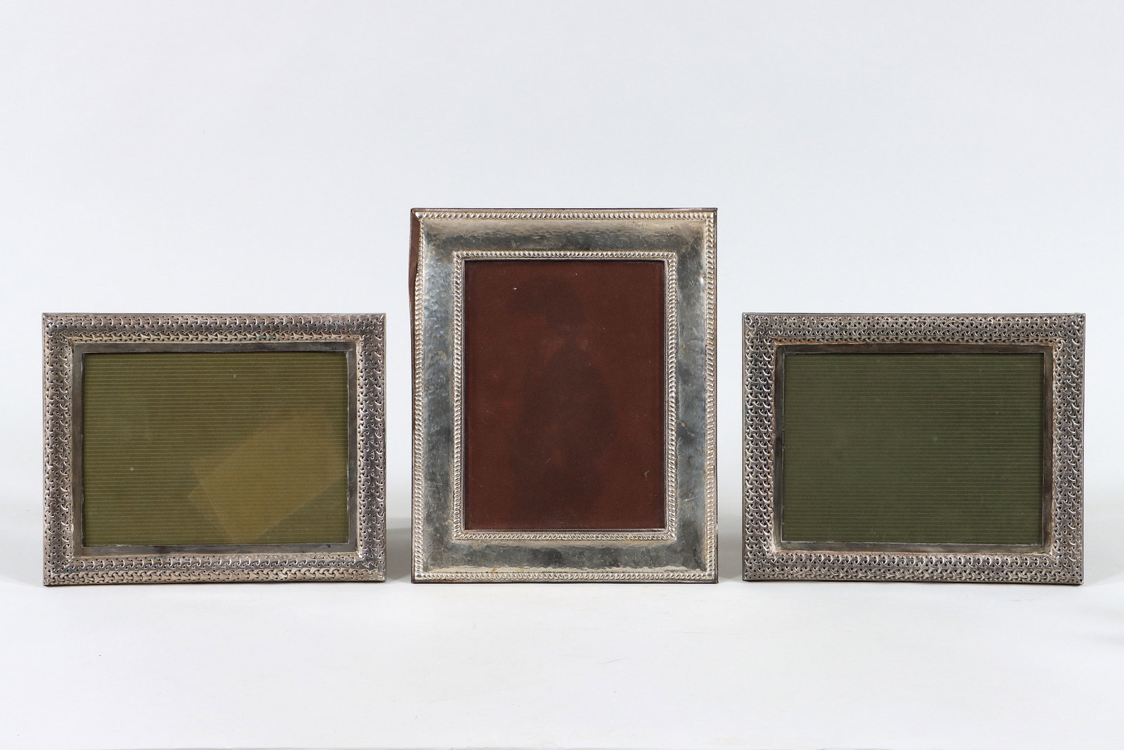 Pair of John Hardy Sterling Frames: Pair of John Hardy Sterling Silver Picture Frames of rectangular form, in woven pattern, with easel-backs, marked; along with an Italian silverplate picture frame, Livi Giancarlo, Florence, of rectang