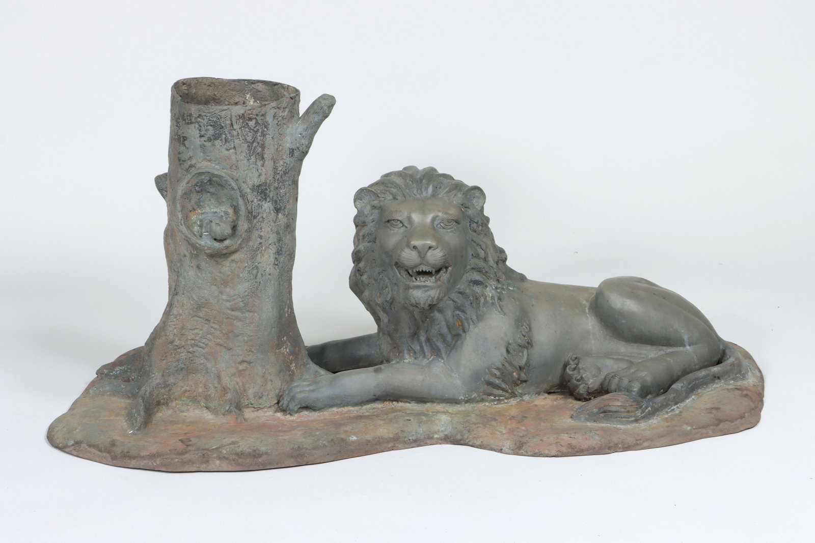 Bronze Planter with Lion: Bronze Planter with Lion depicting a recumbent lion at the base of tree with a hiding mouse. 21 x 22 x 42 1/2 in. (53.3 x 55.9 x 108 cm.)