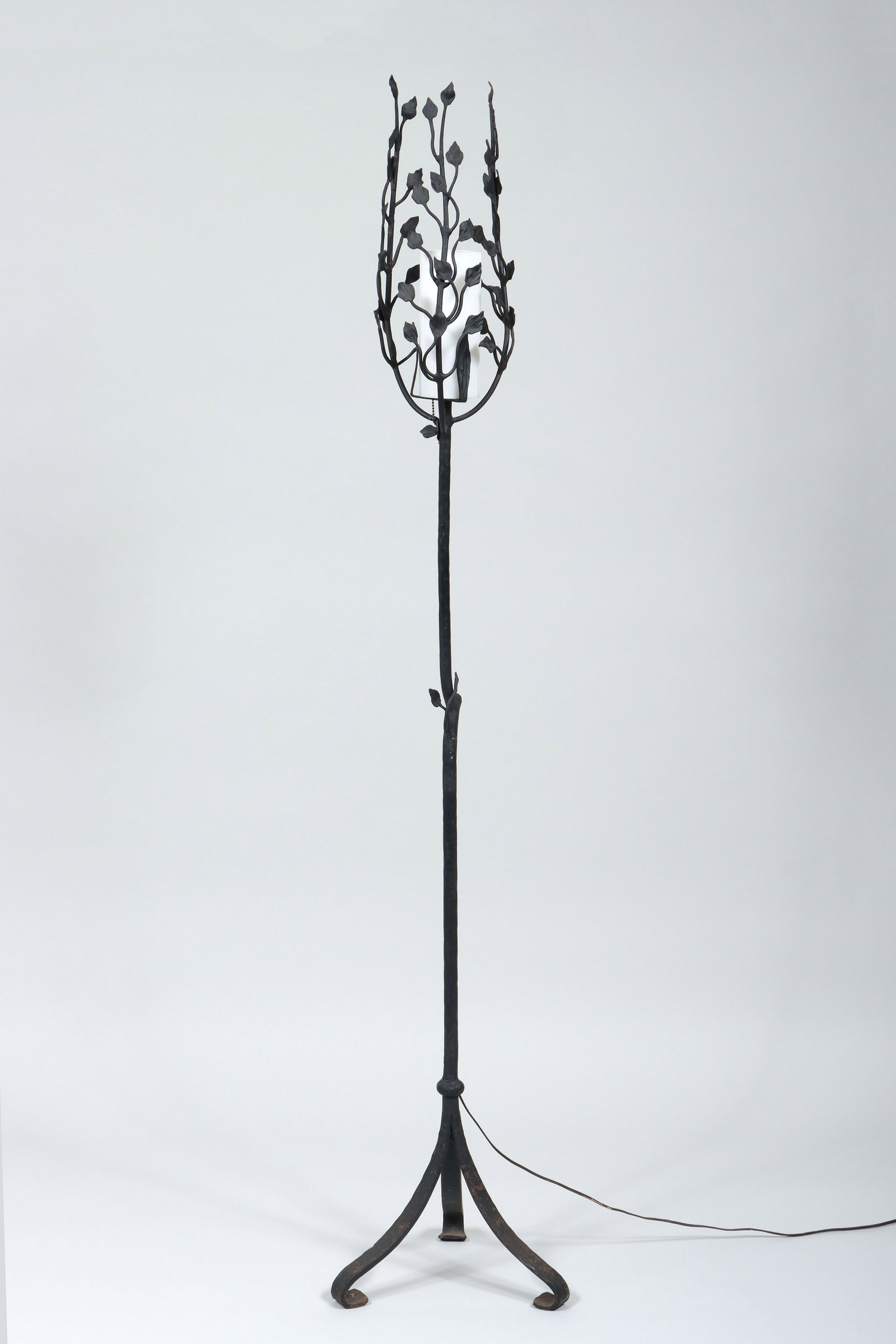 Florentine Craftsmen Wrought Iron Torchere: Florentine Craftsmen Wrought Iron Torchere in the form of a sapling, ending on splayed tripod legs. 70 1/2 in. (179.1 cm.)