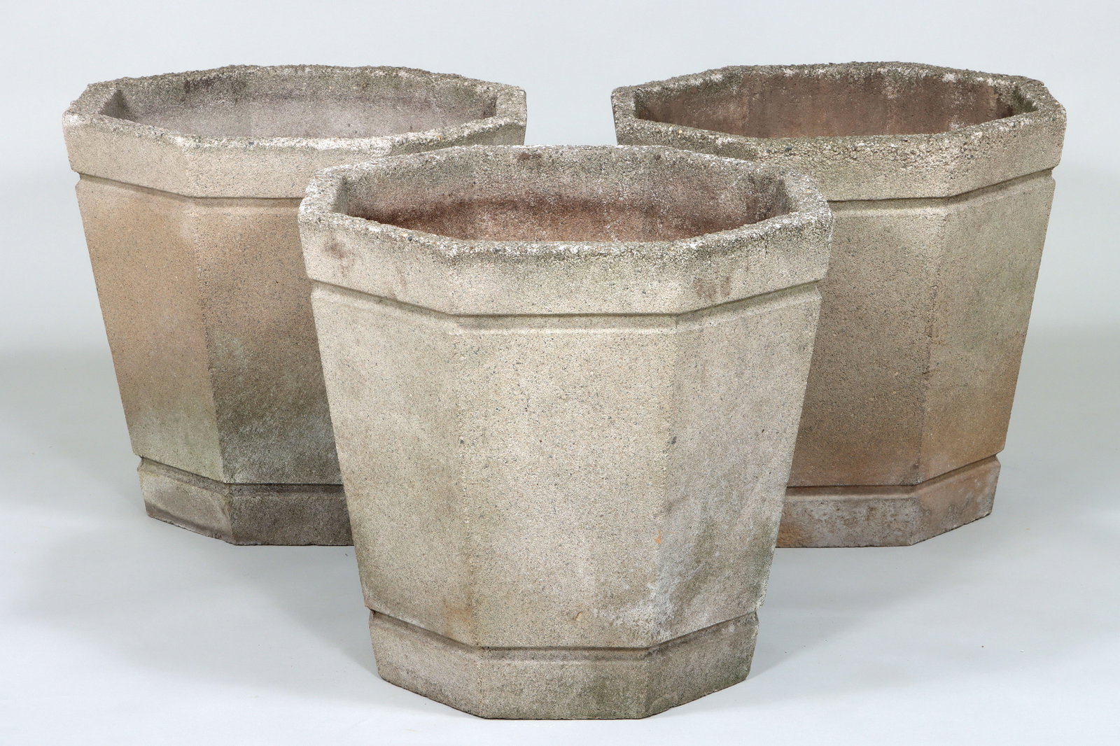 Large Cast Stone Octagonal Planters: Group of (3) Large Cast Stone Octagonal Planters of tapering form. 21 1/2" high x 24 1/4" diameter at top (54.6 x 61.6 cm.)