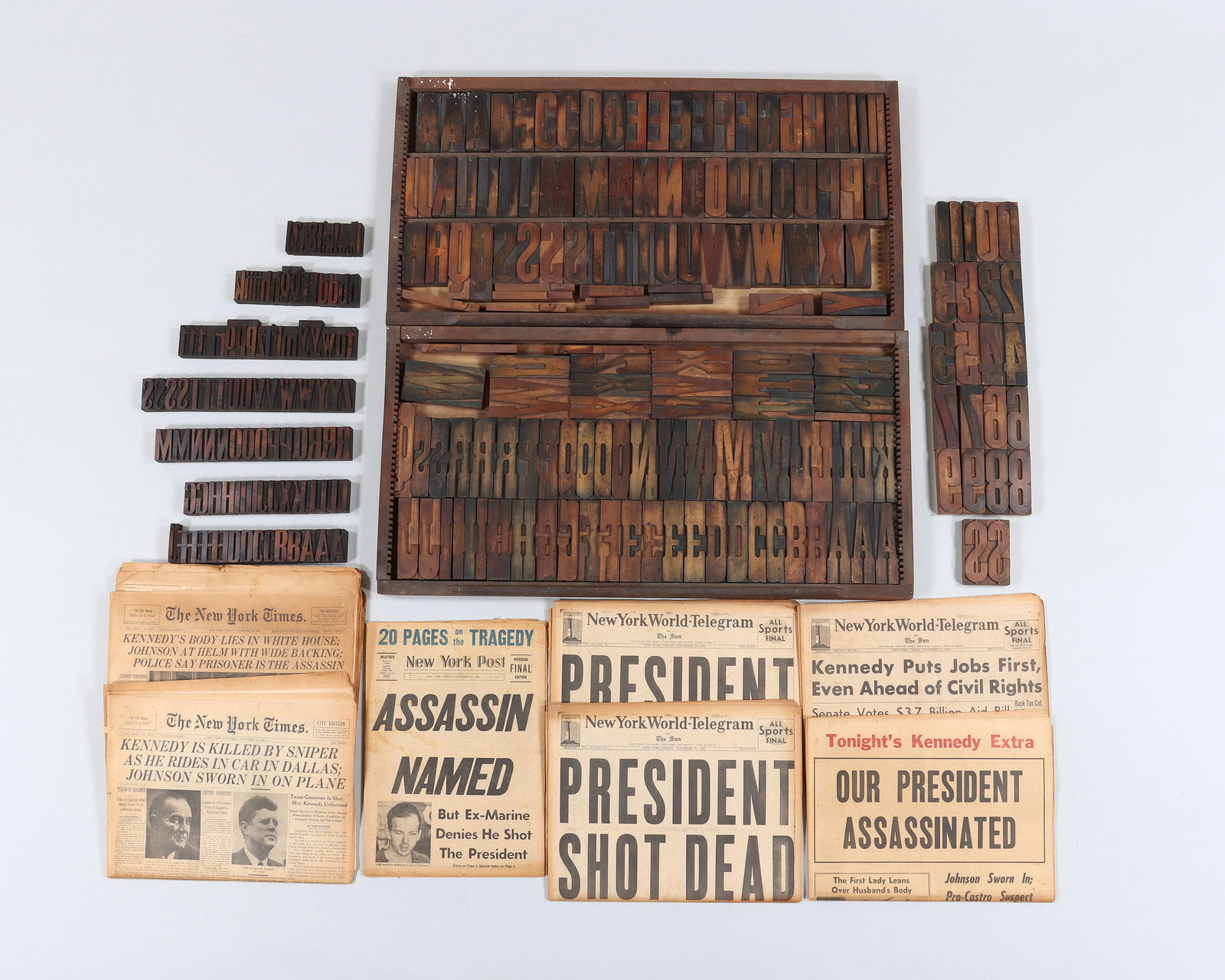 Printing Blocks and Historical Newspapers: Large Collection of (250+) Wood Printing Blocks and Historical American Newspapers to include: set of (73) wood printing blocks with letters and punctuation, in fitted wood rack with adjustable divide