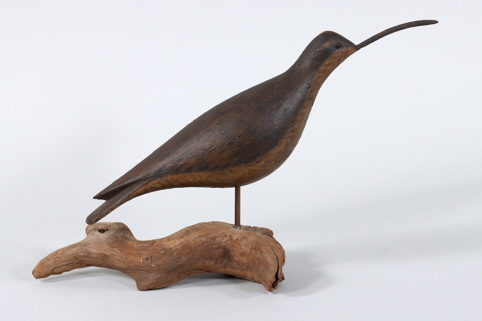 Hollow Carved Curlew, Dennisport, MA: Hollow Carved Curlew, Dennisport, MA age and maker unknown. This full-size curlew with a nail bill and running position has a Gelston style. The paint has a craquelure surface, possibly antiqued, whic
