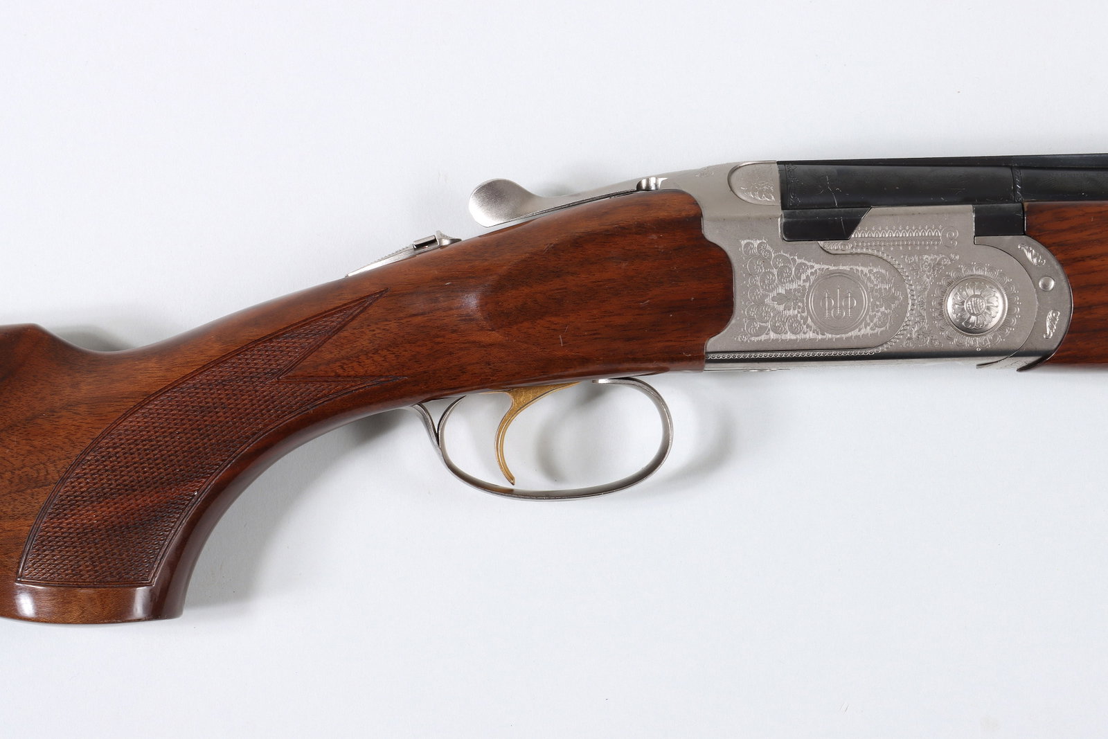 Beretta Silver Pigeon Over-and-Under in 20 Gauge: Beretta Silver Pigeon Over-and-Under in 20 Gauge for both 3" and 2-3/4". The barrels measure 26-1/2" with a vent rib and Mobil screw-in chokes in I/C and Mod. The receiver is engraved with a scroll an