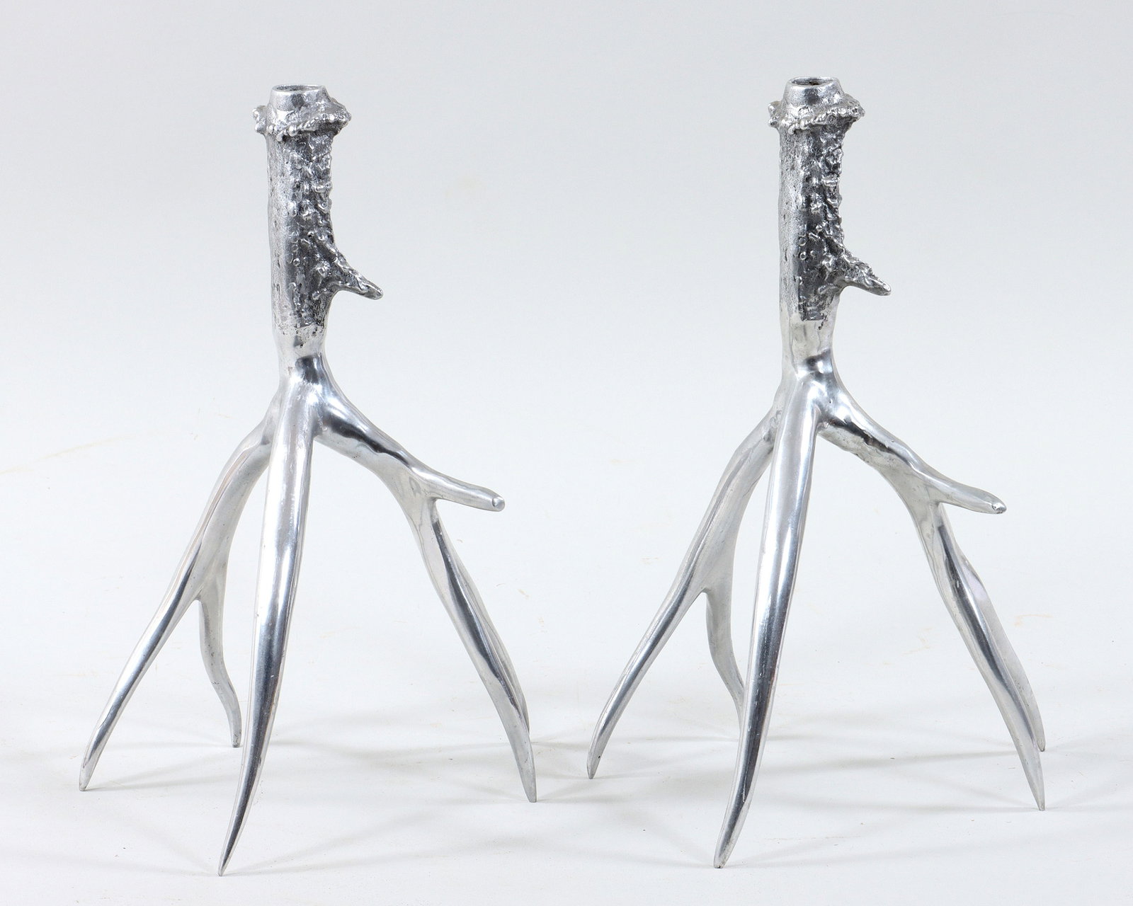 Pair of Arthur Court Antler Candlesticks: Pair of Arthur Court Antler Candlesticks in cast aluminum, unmarked; along with (2) taper candles. Candlestick 14 1/2 x 9 1/2 x 8 1/2 in. (36.8 x 24.1 x 21.6 cm.)