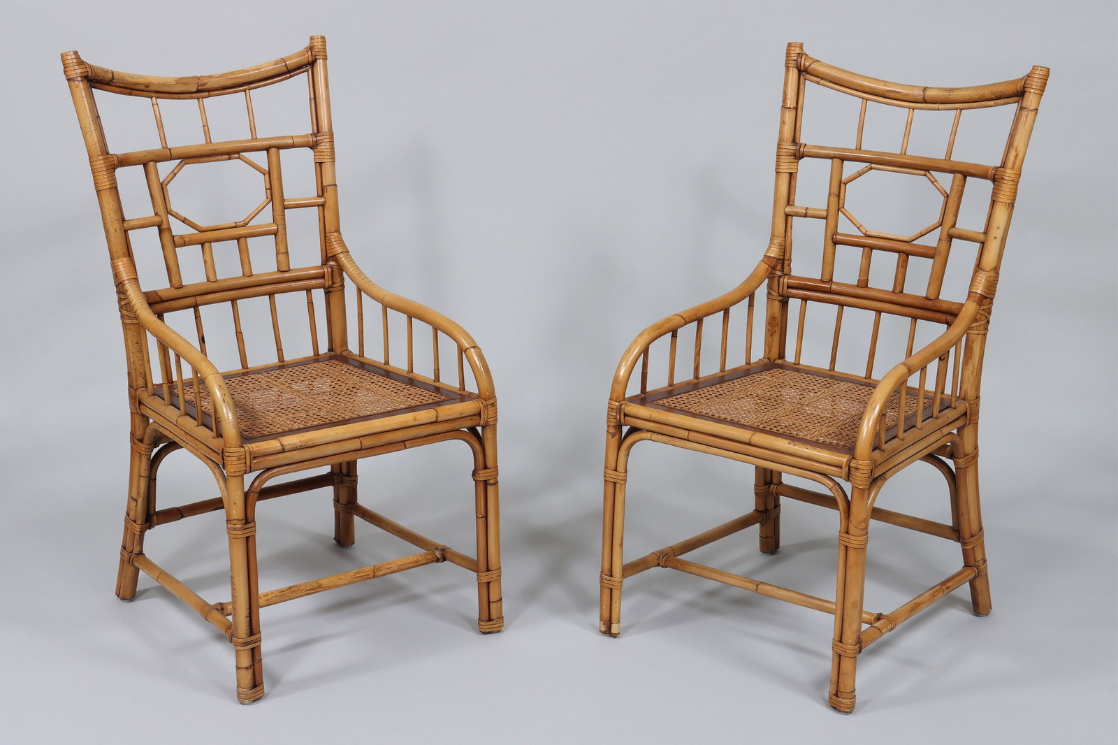 Pair of Bamboo Armchairs: Pair of Bamboo Armchairs with leather wrapping and cane seats. 38 1/2 x 19 3/4 x 22 1/2 in. (97.8 x 50.2 x 57.2 cm.)