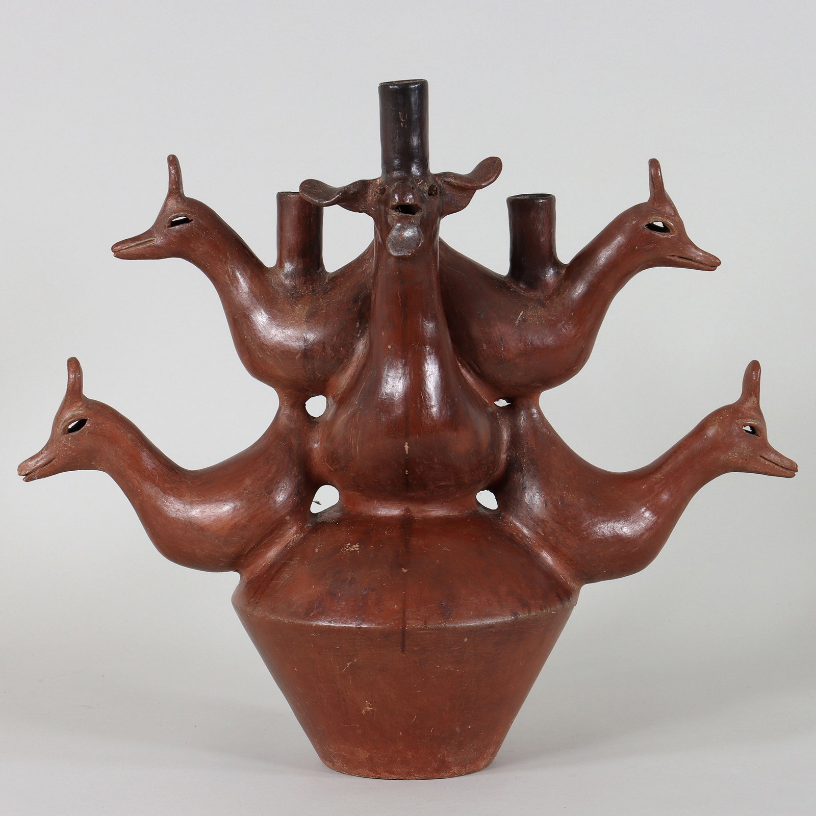 Mexican Folk Art Candelabra: Mexican Folk Art Ceramic Animal Candelabra San Marcos, Tlapazola, Mexico, c. mid-20th century in the style of Heron Martinez Mendoza (Mexican, 1918-1990), in the form of a goat and birds on top of a j