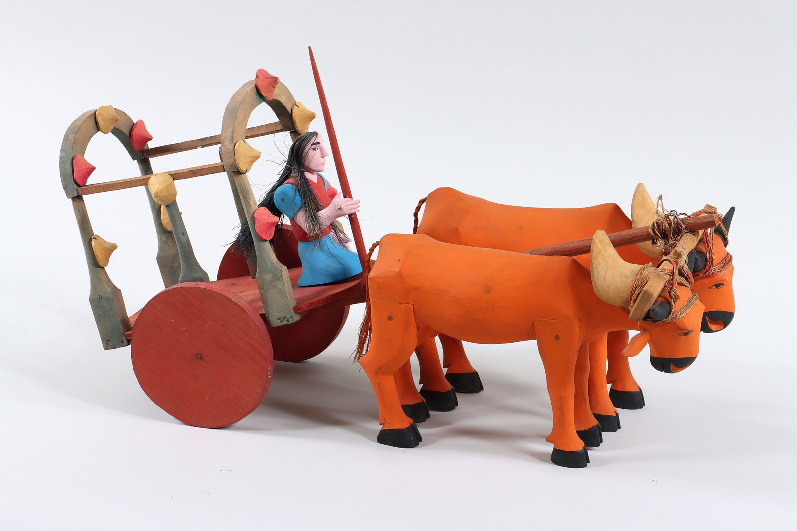 Oaxacan Folk Art: Oaxacan Folk Art Carved and Painted Wood Figure of Woman with Oxen and Cart with twine and dyed plant fiber, signed "Villafane" to underside of cart, possibly Antonio Villafa?e Acevedo, in two parts. 