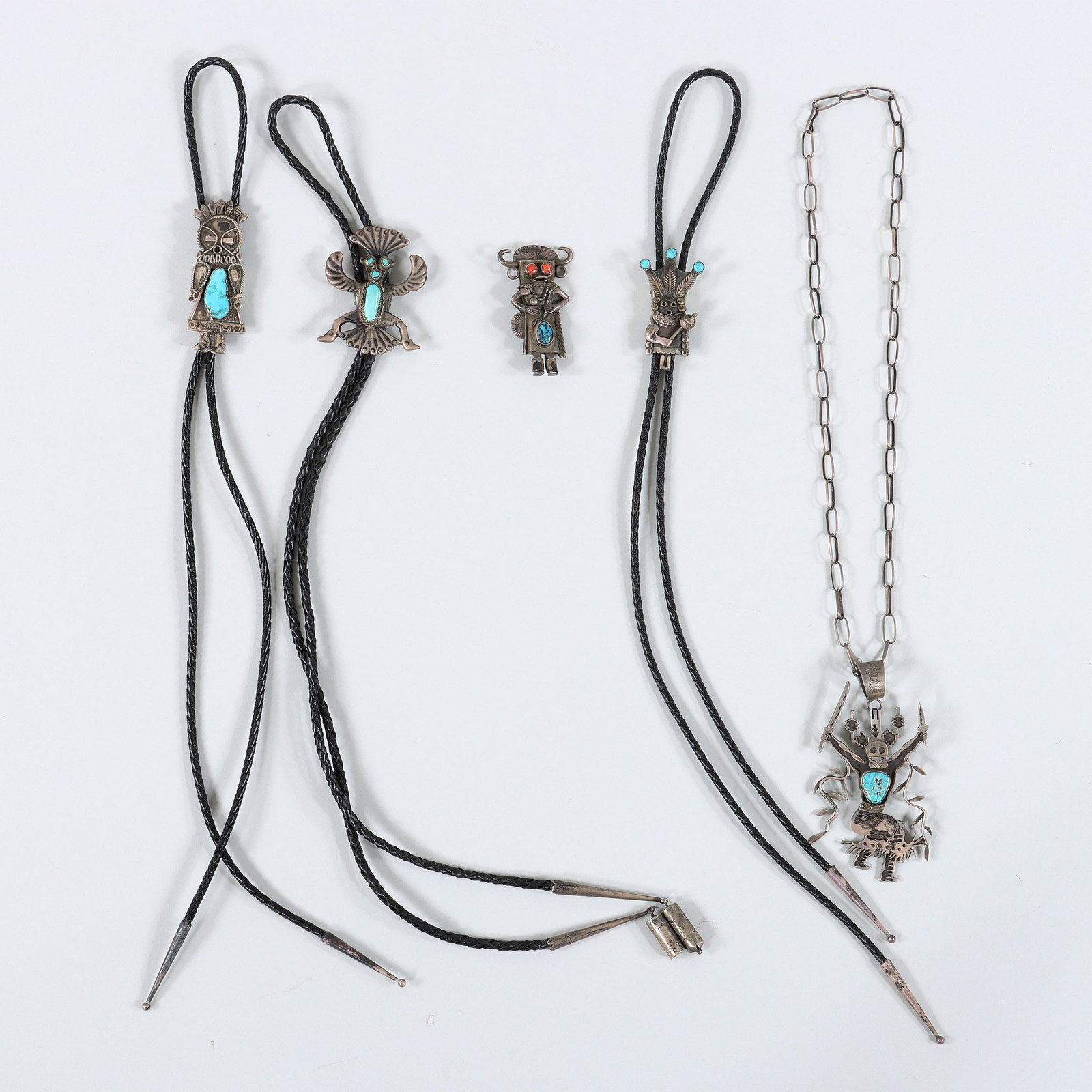 Native American Figural Silver Jewelry: Group of (5) Native American Figural Silver Jewelry to include: Herman Vandever (Dine (Navajo), b. 1964), silver pendant necklace, having pendant in the form of a dancer with knives and vines, signed 