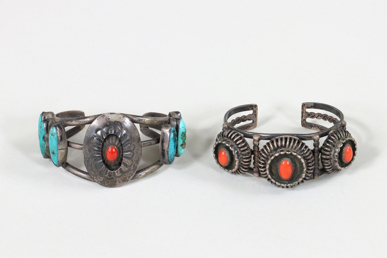 Native American Silver Bracelets: Group of (2) Native American Silver Cuff Bracelets with Coral and Turquoise to include: cuff with (3) coral cabochons in bezel settings, all surrounded by beaded borders and raised on wirework circles