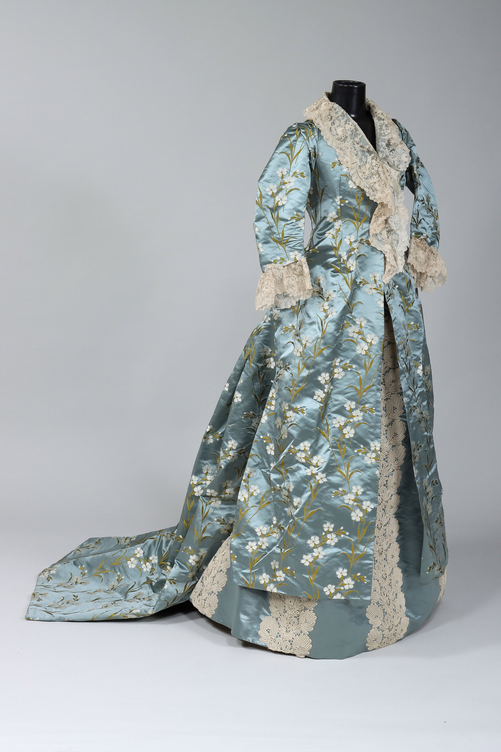 19C Embroidered Silk Reception Gown: Late 19th Century Embroidered Silk Reception Gown c. 1870s/1880s having bodice with embroidered floral motif on blue silk ground, lace trim on collar and at ends of sleeves, buttons and hook-and-eye c