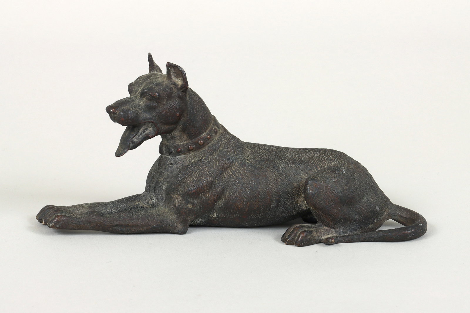 Austrian Bronze Recumbent Dog: Austrian Bronze Recumbent Dog appears unmarked. 3 1/4 x 7 x 2 1/4 in. (8.3 x 17.8 x 5.7 cm.)