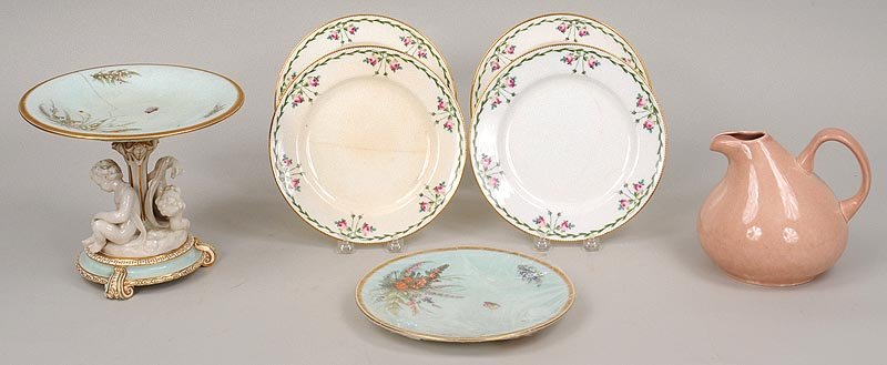 Group of (6) ceramic items: Group of (6) ceramic items to include; porcelain compote with putti (crack to top plate) along with matching broken plate, four porcelain floral decorated Minton plates (9''dia.), and American pitcher