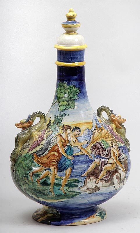 Cantagalli Italian ceramic majolica two handled jug: Cantagalli Italian ceramic majolica two handled jug with topper, scene of harbor and figures with cow, dragons as handles, mark to bottom, 15-1/4''h, 9-1/2''w.