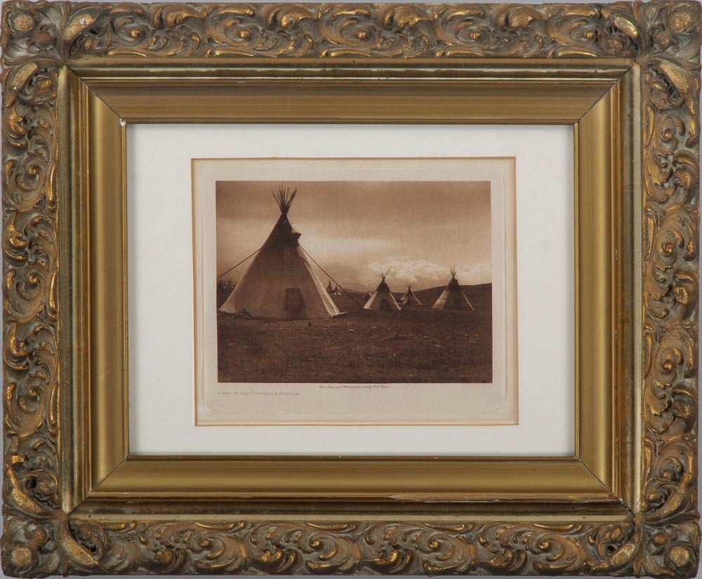 EDWARD SHERIFF CURTIS (American, 1868-1952), ''Camp in: EDWARD SHERIFF CURTIS (American, 1868-1952), ''Camp in the Foothills-Piegan'', photogravure, titled and dated 1905, image 5-1/4''h, 7-1/4''w; glued at corners.