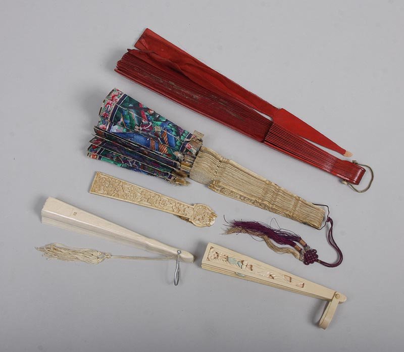 Group of (4) handheld folding fans to include: red wood: Group of (4) handheld folding fans to include: red wood and hand painted muslin fan with bird in tree; carved ivory fan with hand painted Asian theme, double sided, with applied clothing and faces; pi