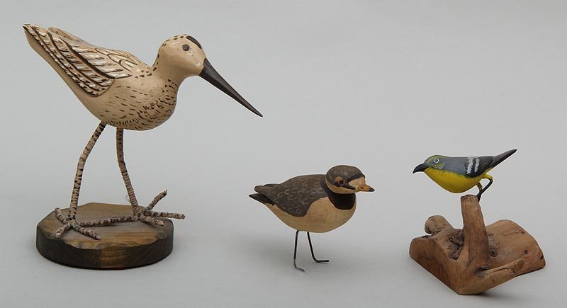 Group of (3) small carved and painted wood birds, to: Group of (3) small carved and painted wood birds, to include: Puerto Rican Honeycreeper, possibly signed on bottom; sandpiper, signed ''Wm E. Balegh''; and grey bird on rock, unsigned. Tallest 6-1/2''