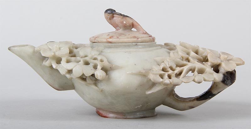 Asian carved soapstone teapot, having bird to lid. Some: Asian carved soapstone teapot, having bird to lid. Some losses. 3-1/2''h, 6-3/4''l.