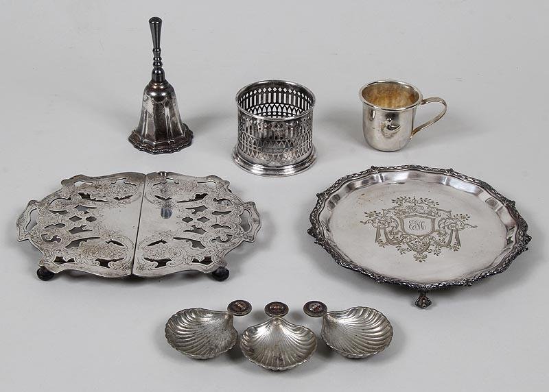 Group of (8) silverplate items to include: sliding: Group of (8) silverplate items to include: sliding trivet, Crescent; claw foot dish, hallmarked ''WC&S'' / ''L'' / ''AI'', 8''dia; Sheffield coaster ???; hand bell; child's cup with duck to side, unma