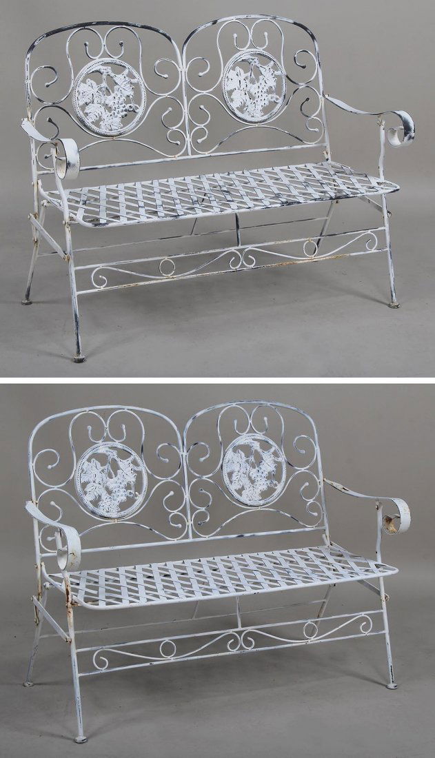 Pair of folding garden settee's with grape medallion: Pair of folding garden settee's with grape medallion back, 35''h, 45''w, 23''d.