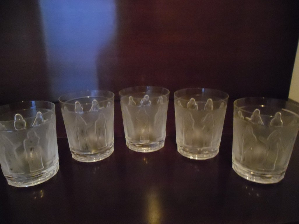 Lalique “Femmes” Whisky Tumblers: Fabulous find! This set of 5 antique whiskey tumblers are of the finest quality by Rene Lalique! Each tumbler holds 12.5 ounces and are 4 inches high. The lovely ladies depicted are on relief on a lig