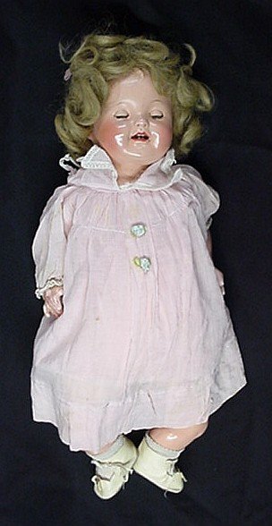 Antique Effanbee Lovums doll: Doll's eyes open and close color in them needs work in used condition