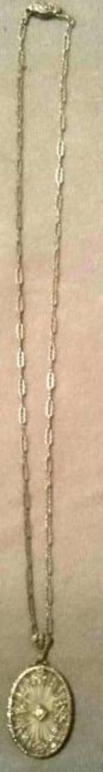 Vintage Art Deco Necklace & Charm: Vintage Art Deco Necklace & Charm This Art Deco charm and necklace brings the Antique look with an elegant feel to light. A rare find in such elegance. 