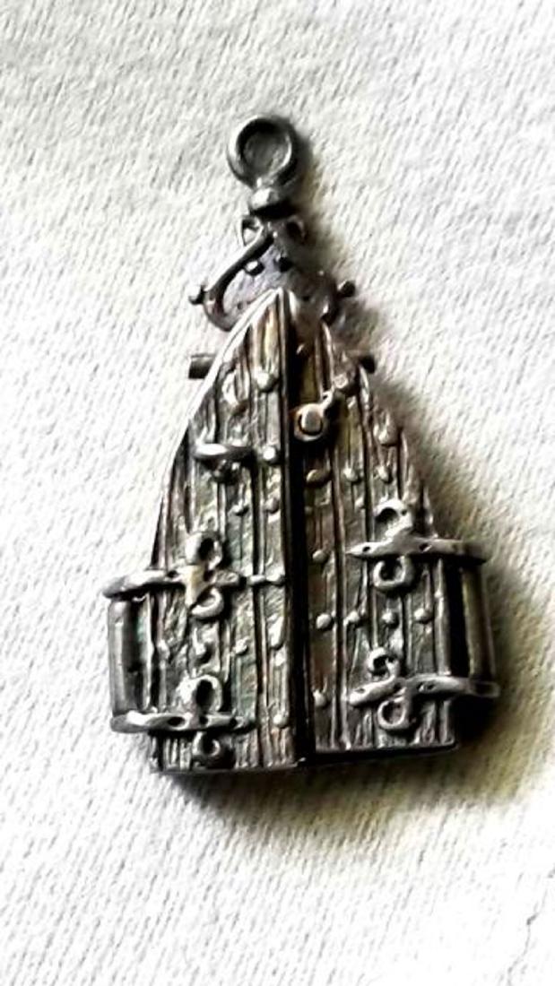 Vintage Sterling Silver Sun Dial: Vintage Sterling Silver Sun Dial with a Dagger that cast the shadow This unique locket opens to have show a hidden dagger. The detail in this is vast. The dagger does move to an outward po