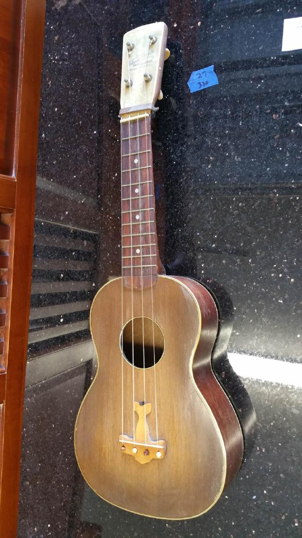 JOHNNY MARVIN PROFESSIONAL TENOR UKELELE/HARMONY CO.: This Johnny Marvin Professional Tenor Ukelele was made by The Harmony Company. This instrument is standard approved by an organization overseeing instruments. It is almost 23 inches wide. Johnny Marvi