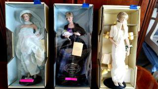 FRANKLIN MINT THREE DIANA DOLLS PRINCESS OF WALES: THE FRANKLIN MINT, Diana, Princess of Wales Porcelain Doll Set of Three in Boxes 1. Diana in Evening Wear, Light Blue Dress in box 2. Diana Tartan 'Evening Gown holding Violet 3. Diana in Evening Wear