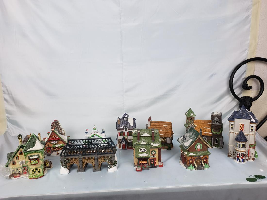 9 Department 56 Heritage Village Collection Houses: Department 56 Heritage Village Collection Houses form both the North Pole and Dicken' Village; The North Pole Collecton has the North Pole Gate, Elfie's Sleds and Skates, Glacier Gazette, Chapel, Sold
