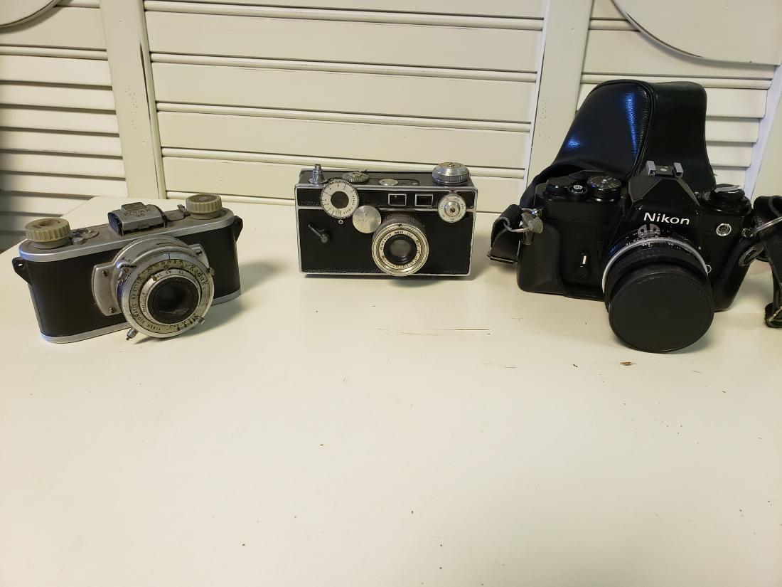 CAMERA, LENS LOT - NIKON, Argus Cintar (C3), KODAK 35: Here is a mixed lot of cameras and lenses. Kodak 35 with Flash Diomatic Shutter, Argus Centar (C3), and Nikon FE (35mm) with an Nikkor 50mm f1:1.8 lens. The thirty-six 24×36 mm frames on 135 film is