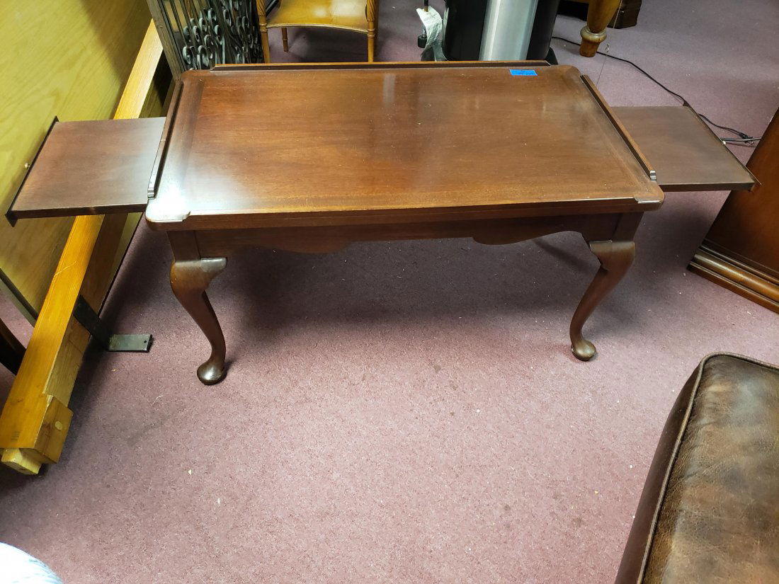 MAHOGANY CANDLE SLIDE TEA TABLE WILLIAMSBURG 18th CENTU: While the world's first coffee table was invented by J. Stuart Foote in 1920, candle slides would not have been in use at that time. So we could say this is a tea table, however, tea tables are a bit