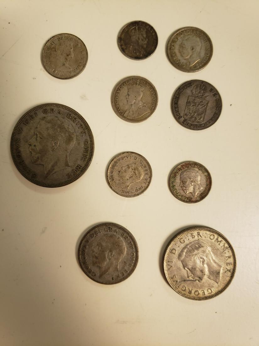 10 Silver Foreign Coin Lot: 10 Various silver foreign coin lot of various dates, mint marks & grades. Includes Two Shillings, One Shilling, Half Crown & more.