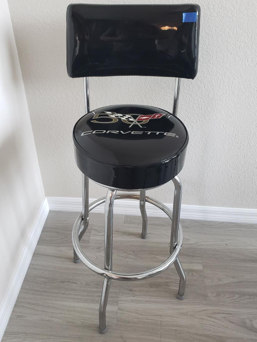 ADVERSTOOL BRAND CORVETTE 50 YEARS BARSTOOL SWIVEL BLAC: Here's a barstool that you will love if you are a car collector, either for the man cave or for the girl cave. This one is a bit nicer than most, and you will not find these at auction, because people