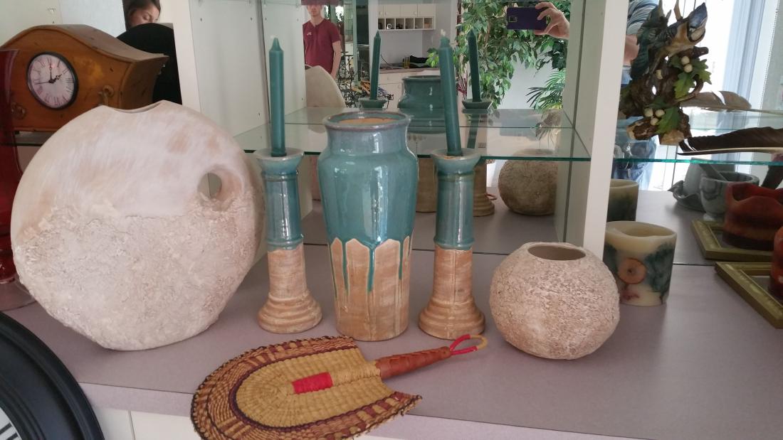 FIVE PIECE POTTERY LOT and WOVEN GRASS FAN: Nice and interesting five-piece pottery lot, with an interesting matching set of three in a drippy blue glaze. Woven old face fan. Abstract white pottery set.