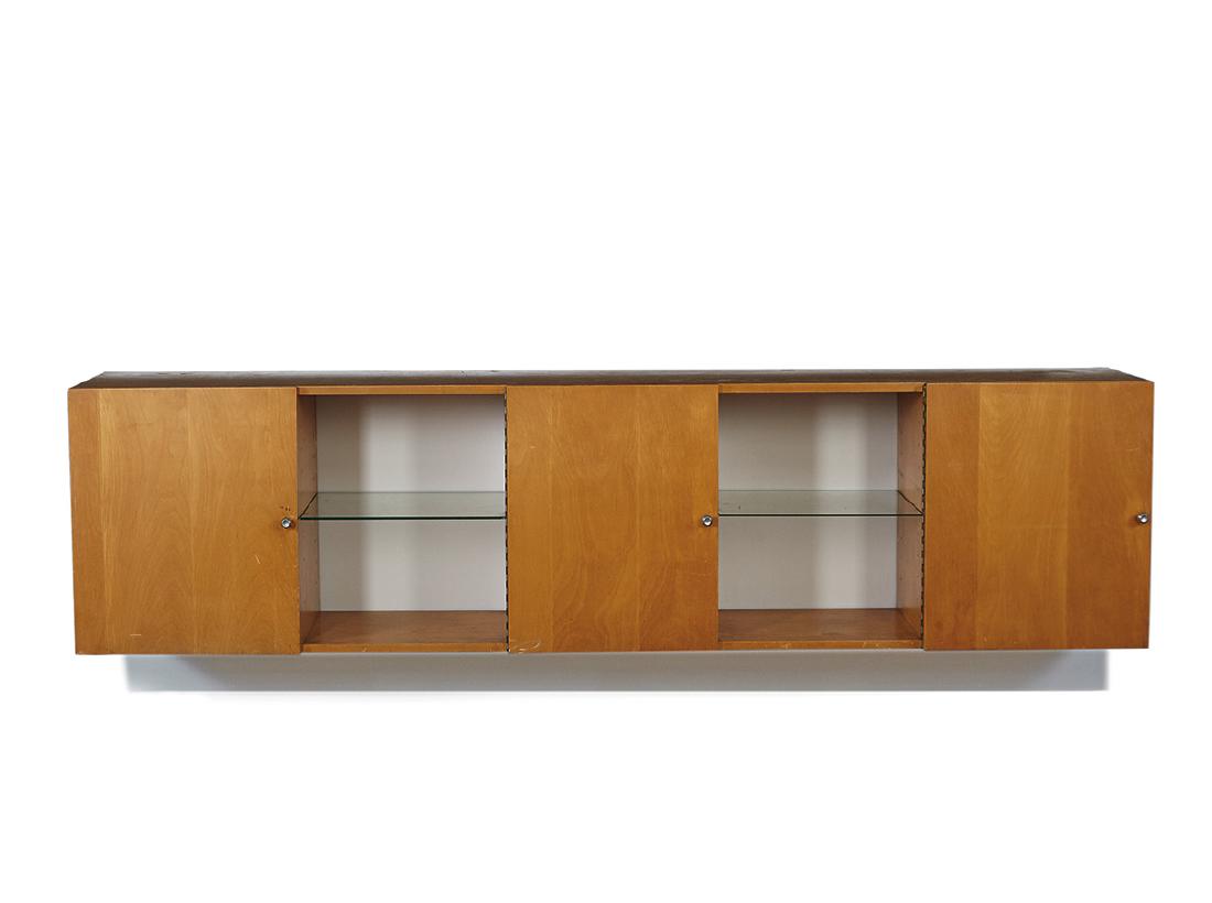 Alvin Lustig: Wall cabinet: Alvin LustigWall cabinet Custom executed c. 1953 24" x 96" x 16.75" Provenance: Corinne Chochem-Kovarsky, Los Angeles, California (acquired directly from the artist, c. 1953); Thence by descent
