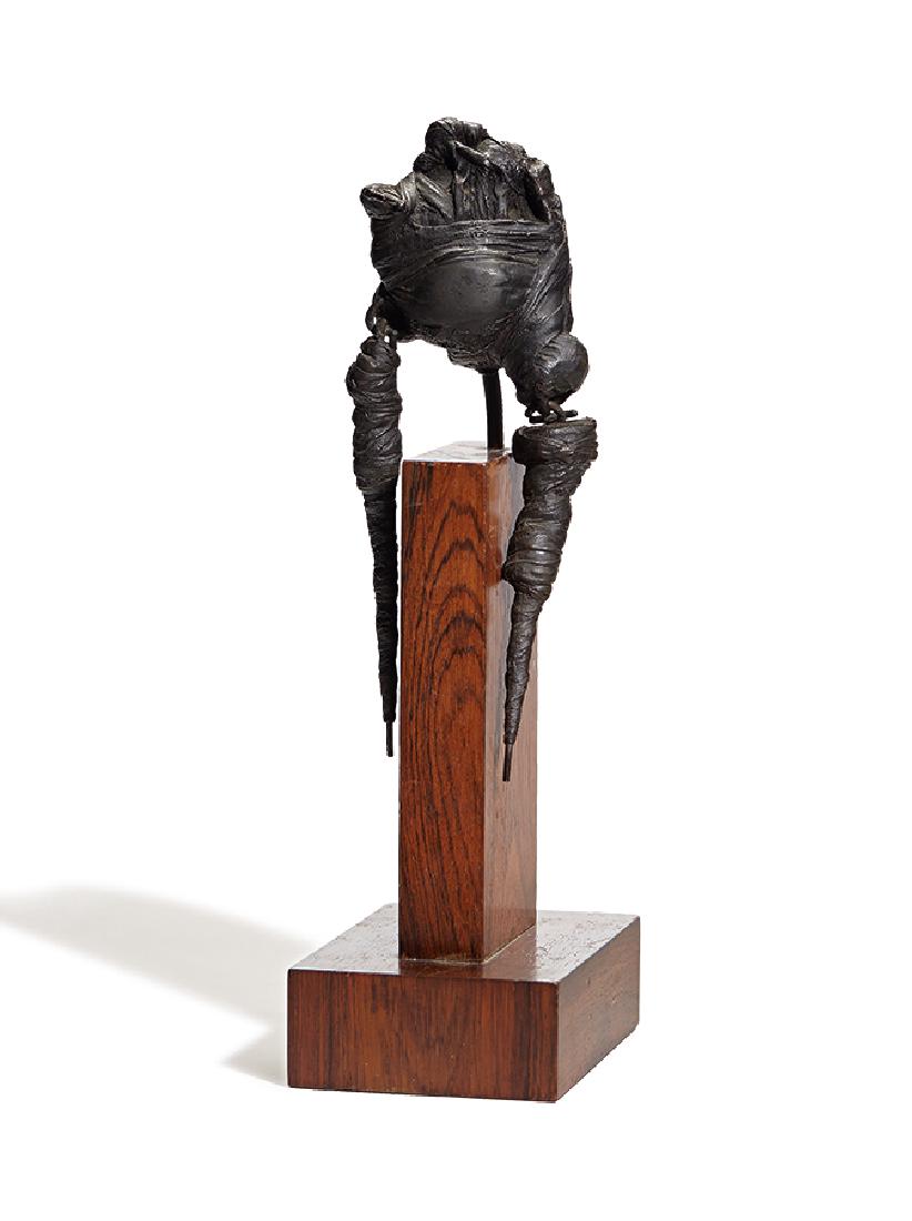 Jack Stuck: Figure: Jack Stuck Figure C. 1960 #1 of 3 Together with copy of Comara Gallery appraisal dated January 12, 1977 Bronze mounted to rosewood base #1 of 3 14" x 14" x 6" (including base)