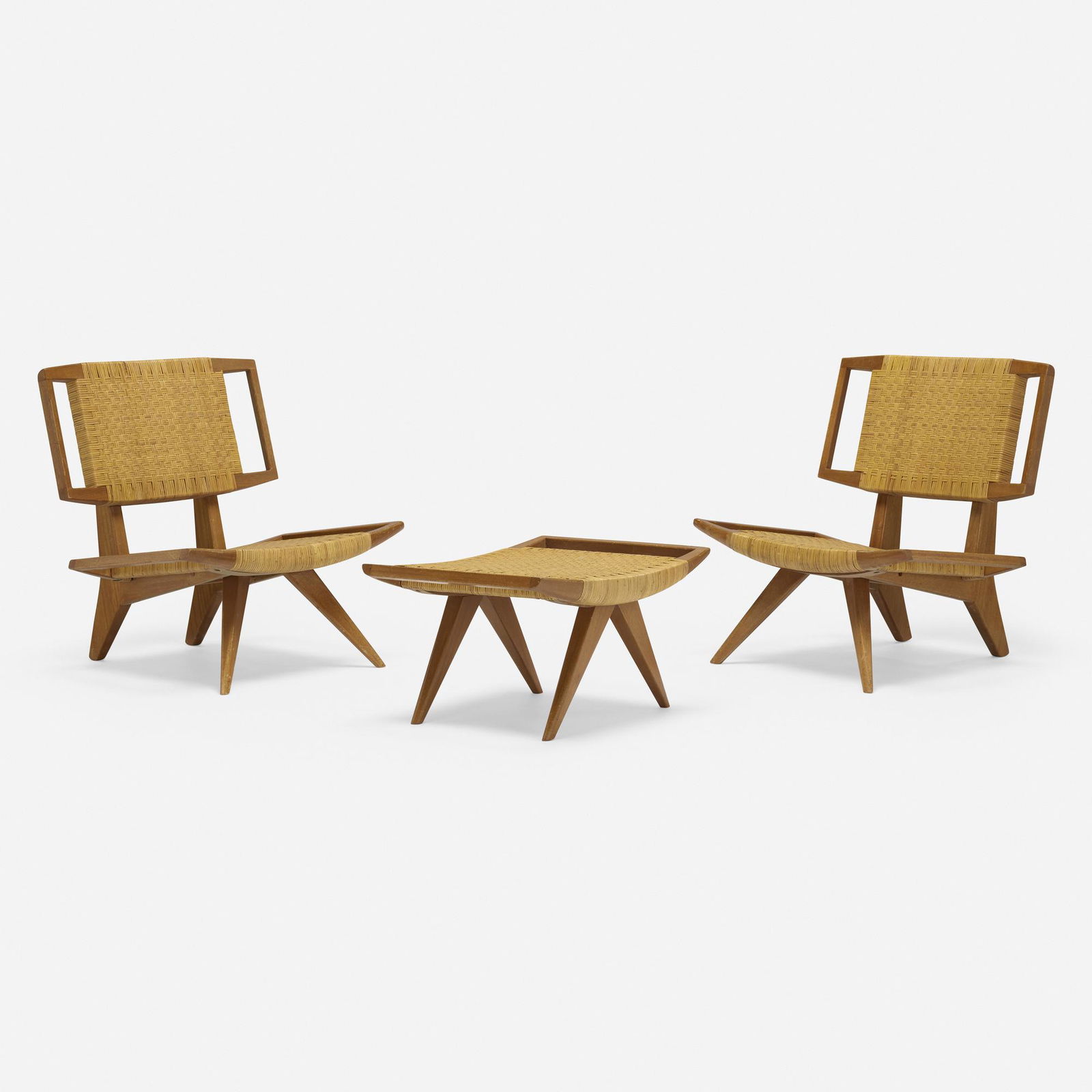 Paul Laszlo, Lounge chairs, pair and ottoman: Paul Laszlo Lounge chairs, pair and ottoman Glenn of CaliforniaHungary/USA, 1950 / 1962walnut, cane chairs: 32 h × 29 w × 28.25 d in (81 × 74 × 72 cm) ottoman: 15 h &