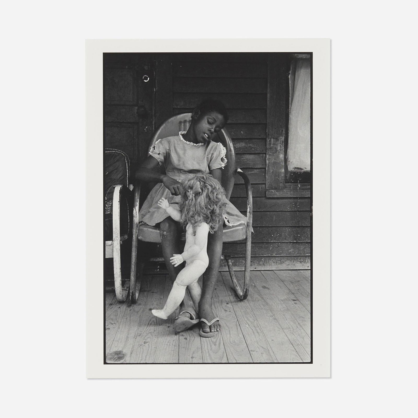 Bruce Davidson, Child ...: Bruce Davidson Child on a Front Porch Playing with her Doll Baby, Shelby County, TN 1962 / printed 1999gelatin silver print image: 10 h x 6.75 w in (25 x 17 cm) sheet: 13.875 h x 11 w in (35 x 28