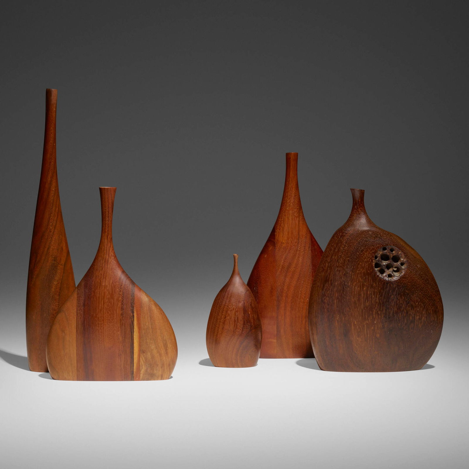 Tom Trammel and Doug Ayers, Five vases: Tom Trammel and Doug Ayers Collection of five vases walnut, afromosia, various woods largest: 10.75 h x 5.625 w x 1.625 d in (27 x 14 x 4 cm) smallest: 5.75 h x 2.5 w x 1.75 d in (15 x 6 x 4 cm)