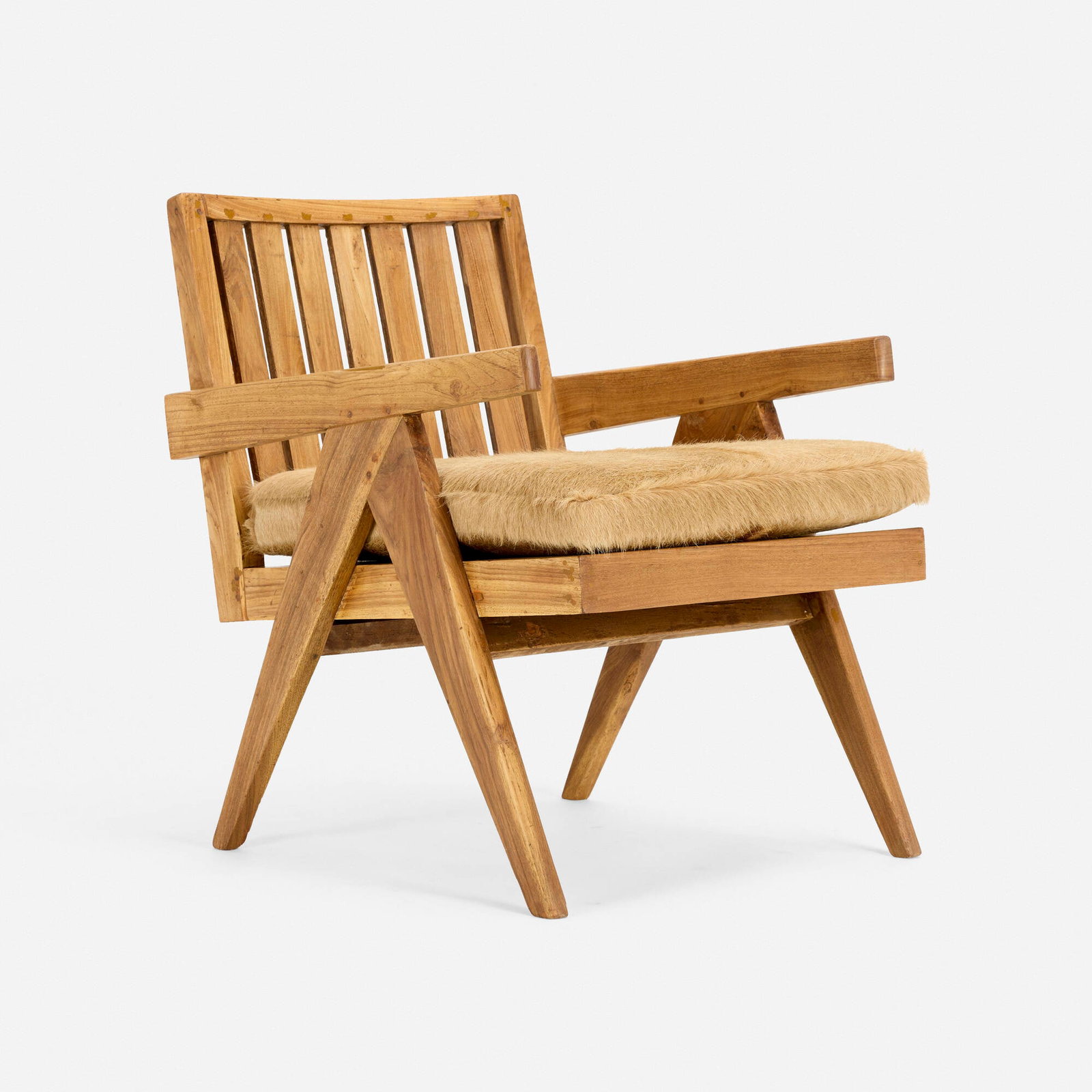 Pierre Jeanneret, Armchair: Pierre Jeanneret Armchair France/India, c. 1955 teak, pony hide 27.25 h x 20.75 w x 27 d in (69 x 53 x 69 cm) Painted mark to back rail. Provenance: Chandigarh, India |