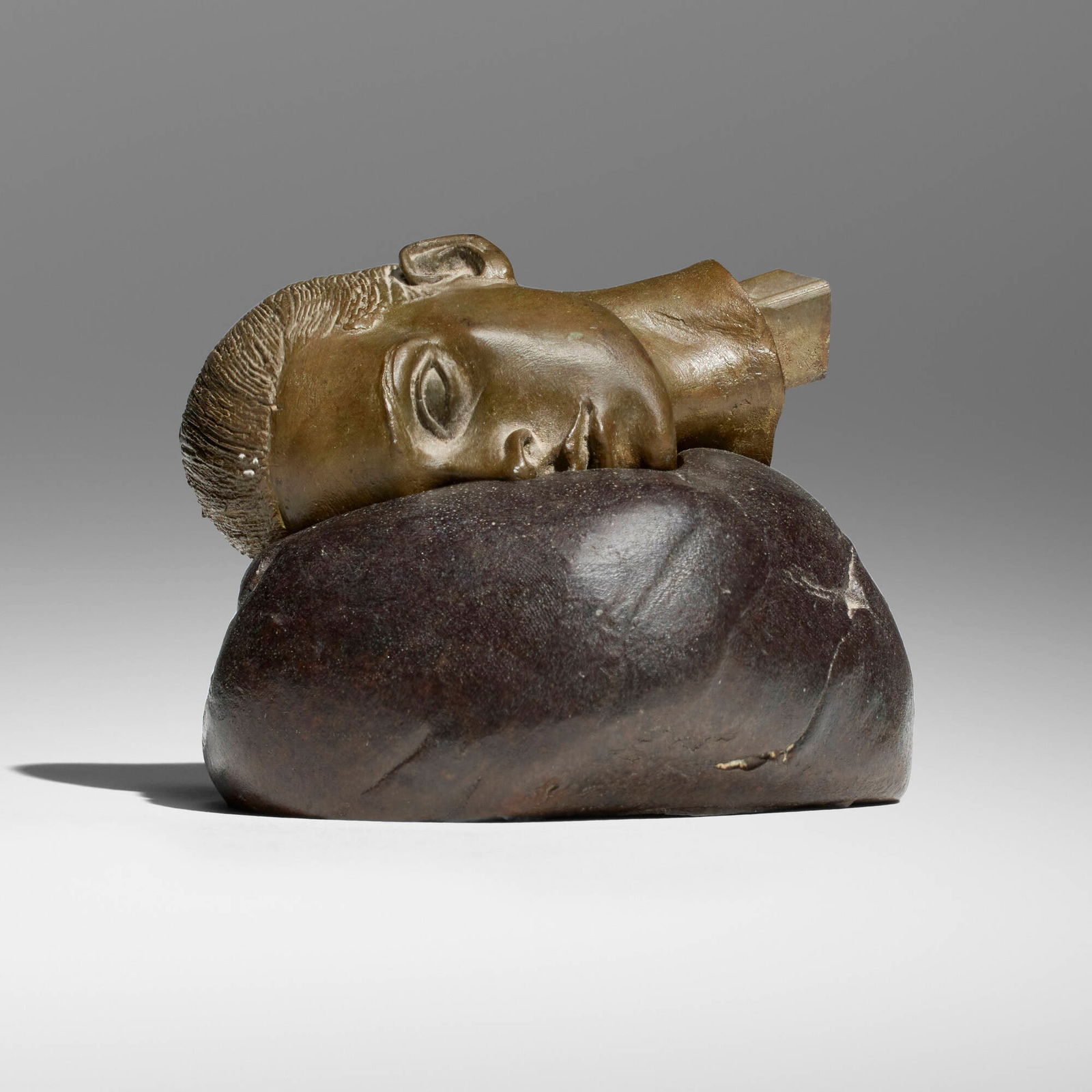 Robert Graham, Fragment Head: Robert Graham Fragment Head c. 1995patinated bronze 2.5 h x 3.5 w x 3.25 d in (6 x 9 x 8 cm) Incised signature to underside 'R. Graham'. This work will ship from Los Angele