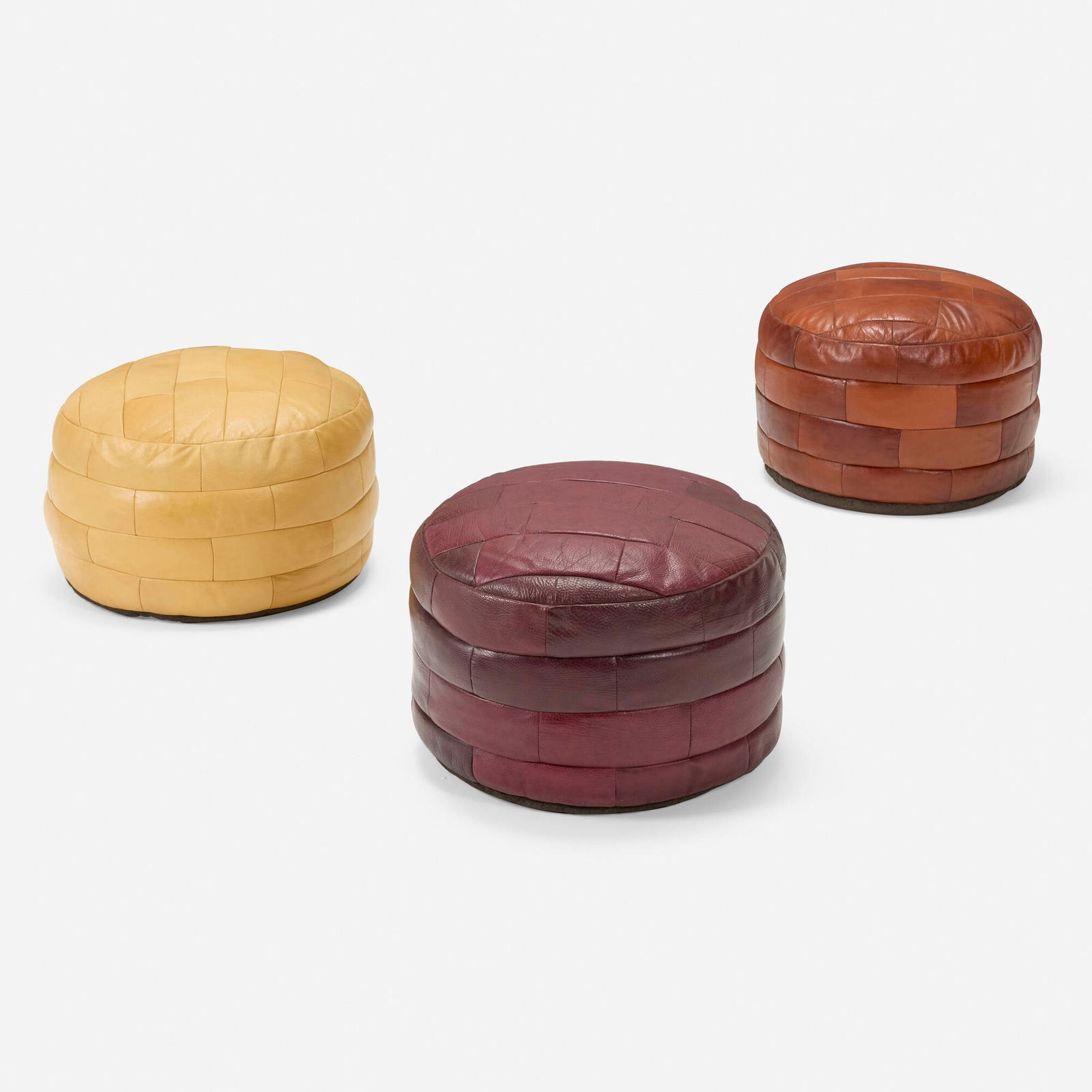 De Sede, DS 80 ottomans, set of three: De Sede DS 80 ottomans, set of three Switzerland, c. 1965leather 13 h x 20.5 dia in (33 x 52 cm) This work will ship from Los Angeles, California.