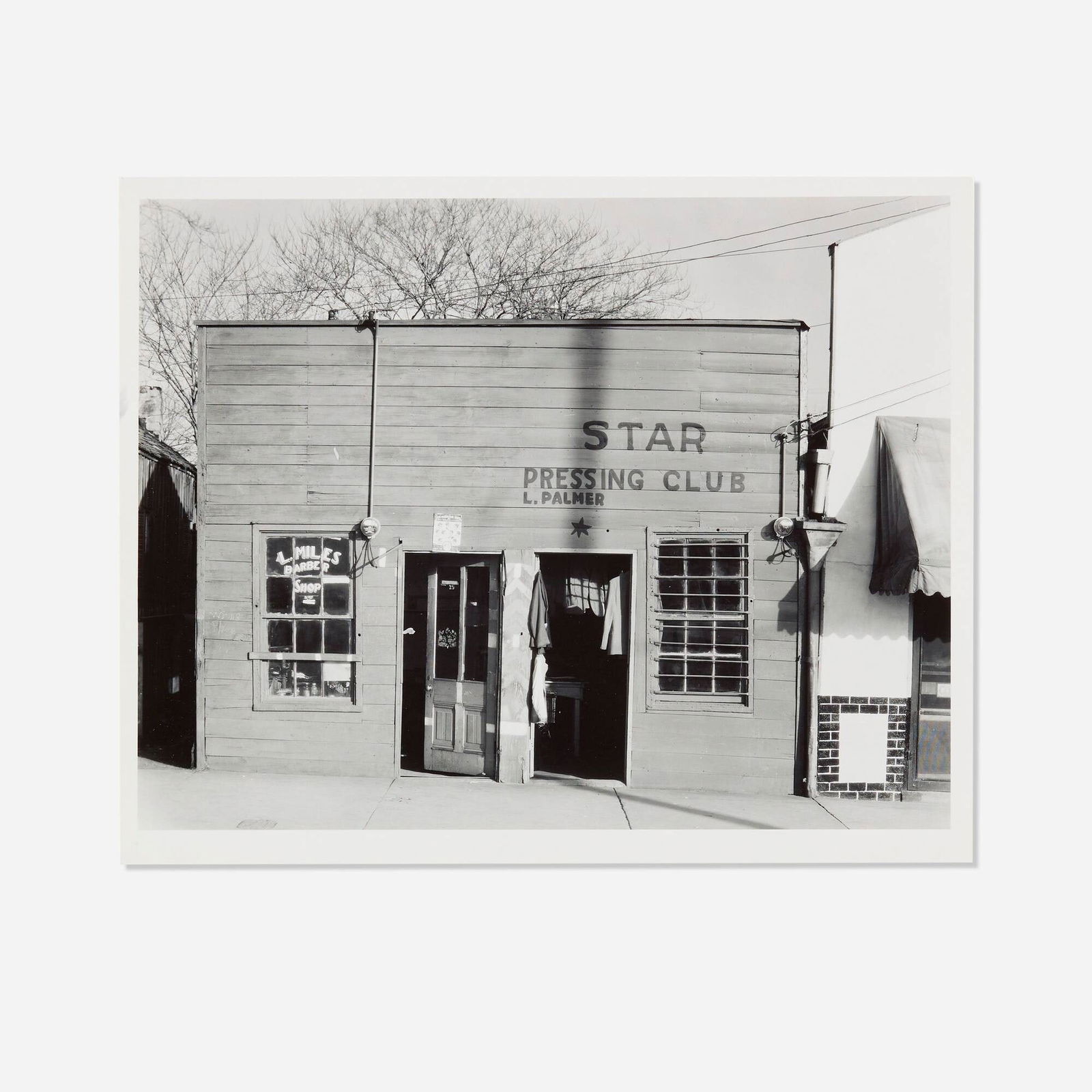 Walker Evans, Star Pressing Club, Vicksburg, MS: Walker Evans Star Pressing Club, Vicksburg, MS 1936 / printed latergelatin silver print image: 7.250 h x 9.375 w in (18 x 24 cm) sheet: 8.000 h x 10.000 w in (20 x 25 cm) Stamped to verso '