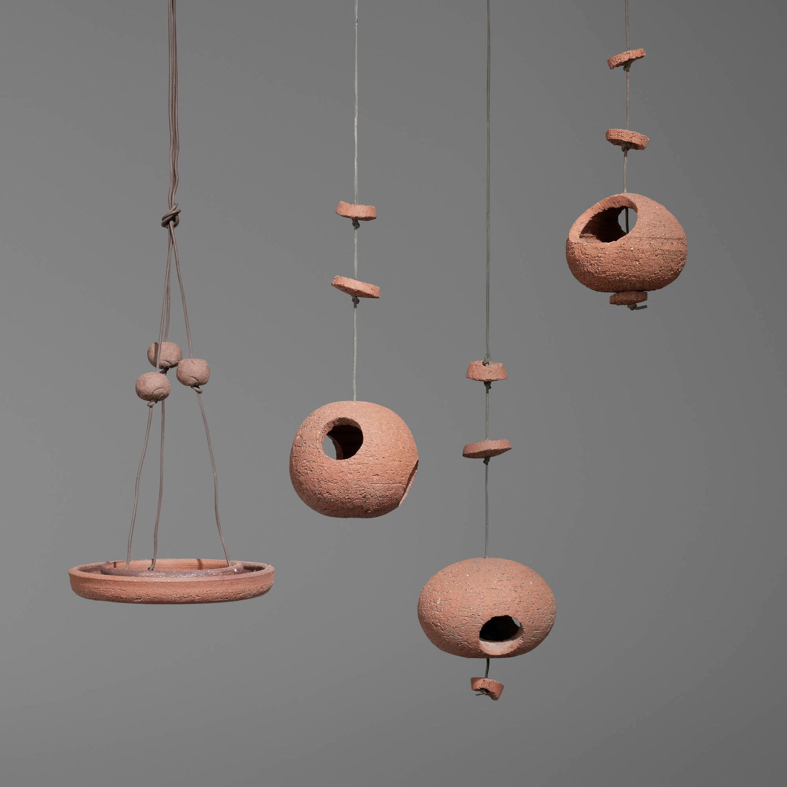 Stan Bitters, Collection of four birdhouses: Stan Bitters Collection of four birdhouses Hans Sumpf Co.USA, c. 1960porous low-fired clay, cord largest: 33.5 h x 10.625 dia in (85 x 27 cm) smallest: 12.5 h x 6.25 dia in (32 x 16 cm) <