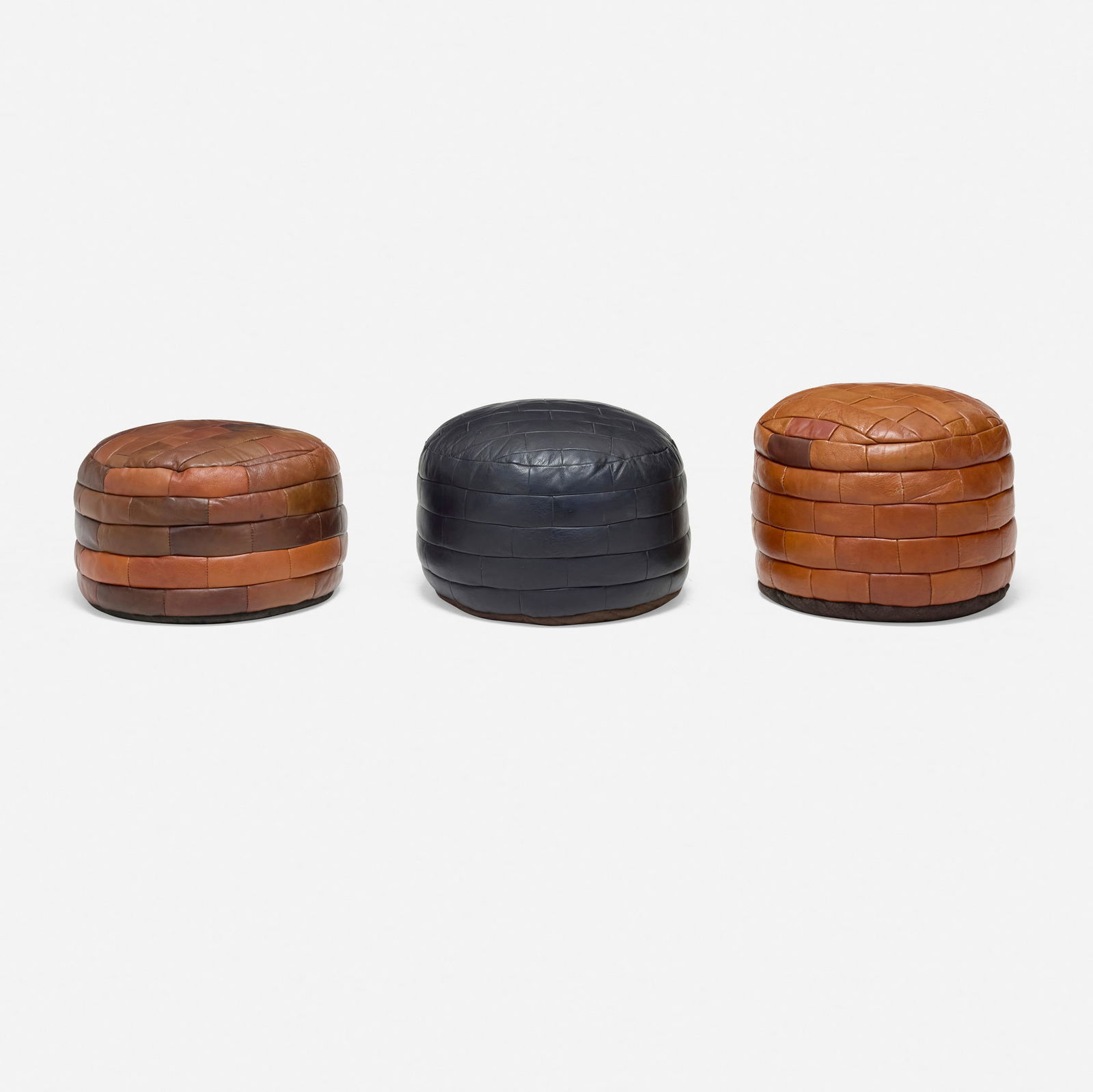 De Sede, DS 80 ottomans, set of three: De Sede DS 80 ottomans, set of three Switzerland, c. 1965stitched leather 14 h x 20.5 dia in (36 x 52 cm) This work will ship from Los Angeles, California.